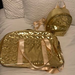 Gold duffle and mini bag set worn once